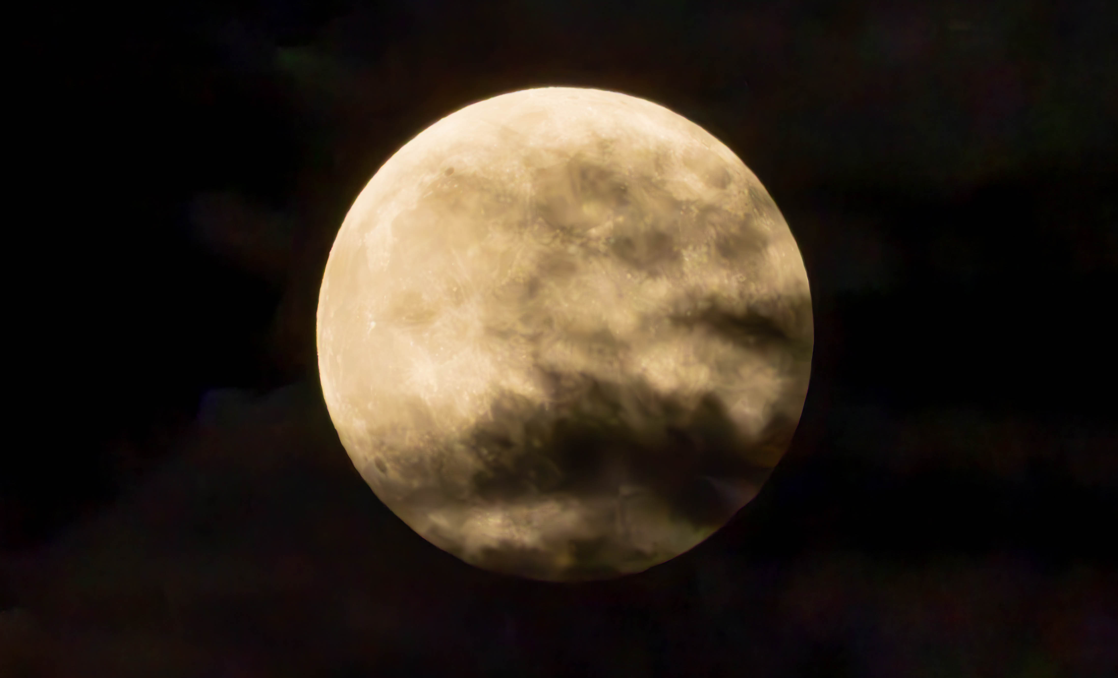Moon covered by some clouds -- don't zoom in too close, otherwise you'll see how low resolution it is xd