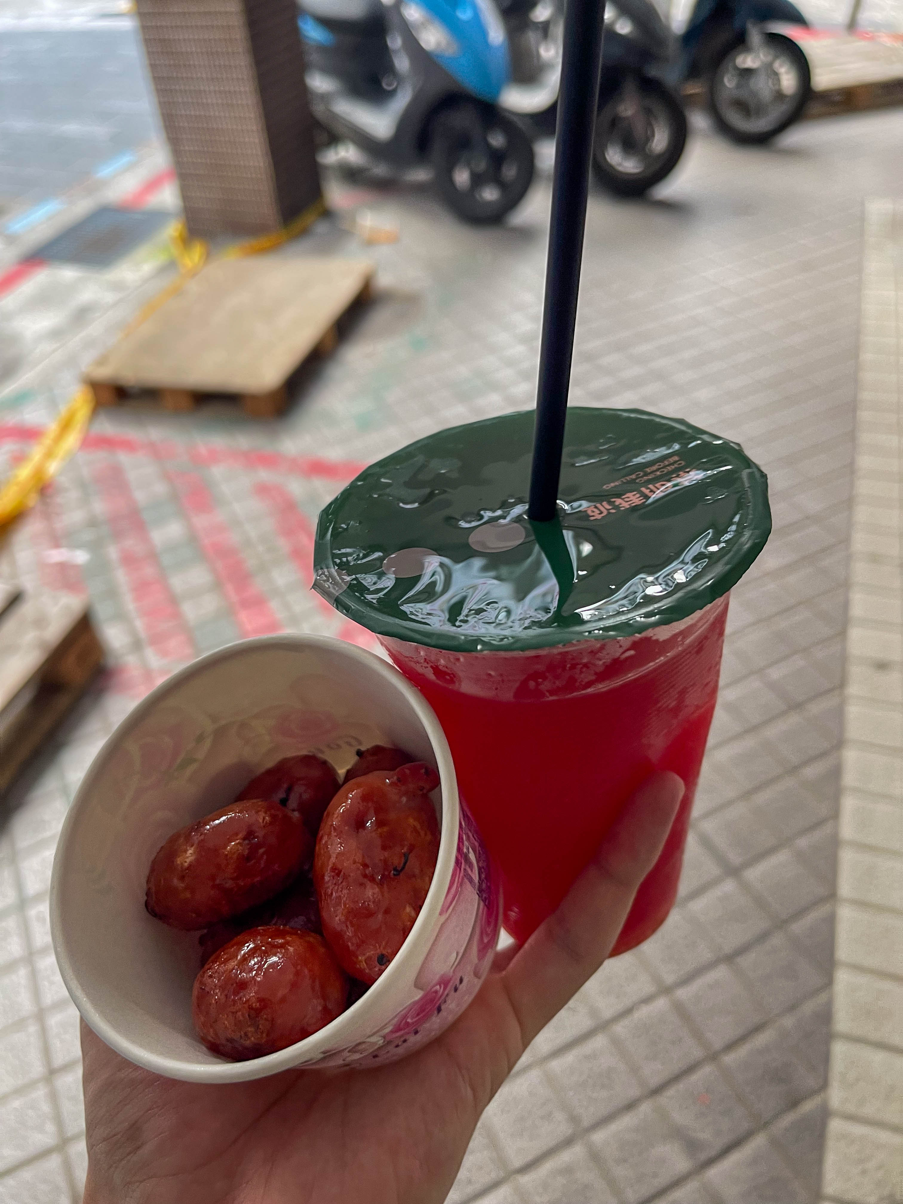 Food I got from the Shilin Night Market in Taipei, Taiwan. Shilin Sausage and watermelon juice!