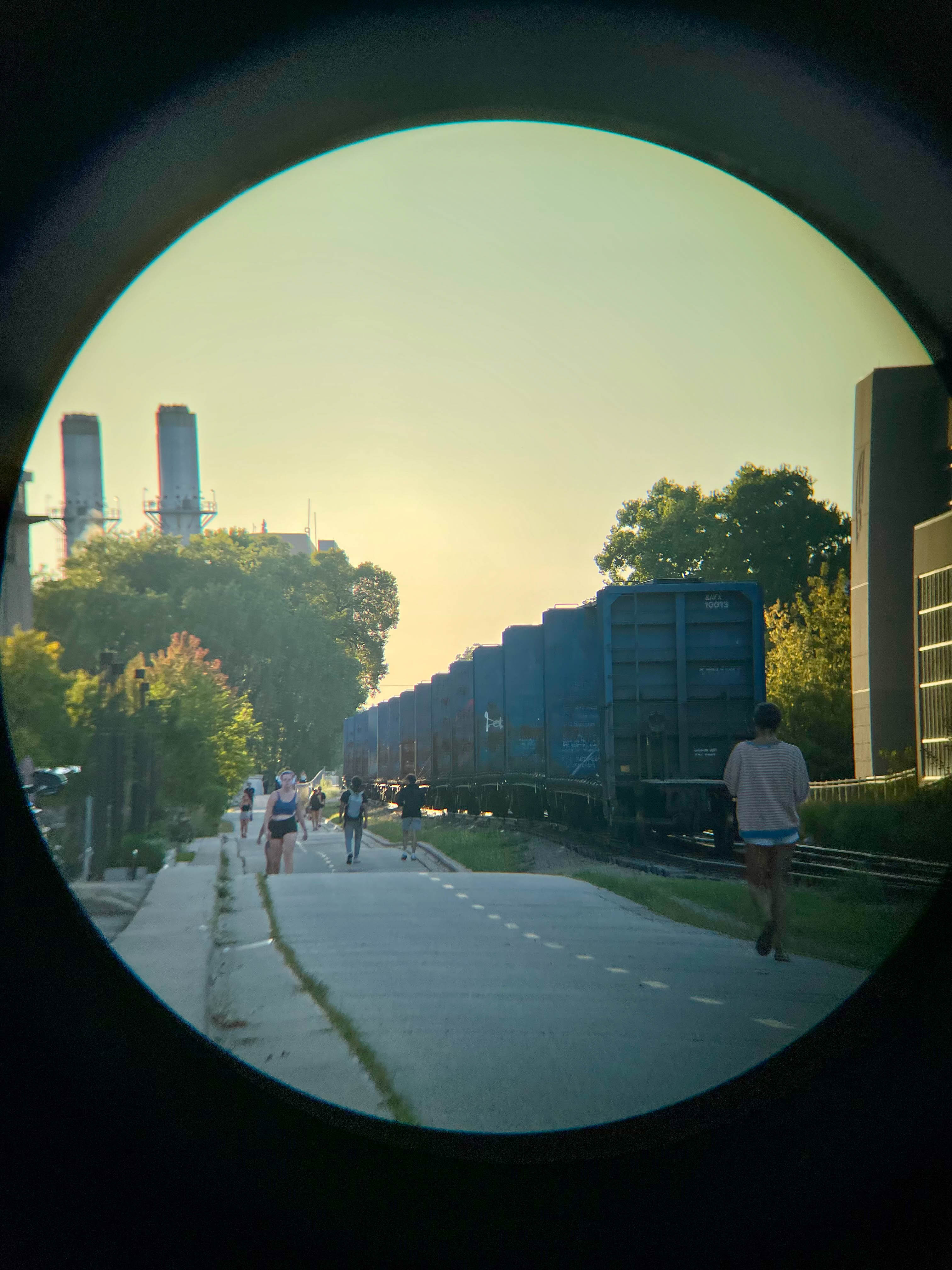 Picture of a path at sunset, framed using binoculars.